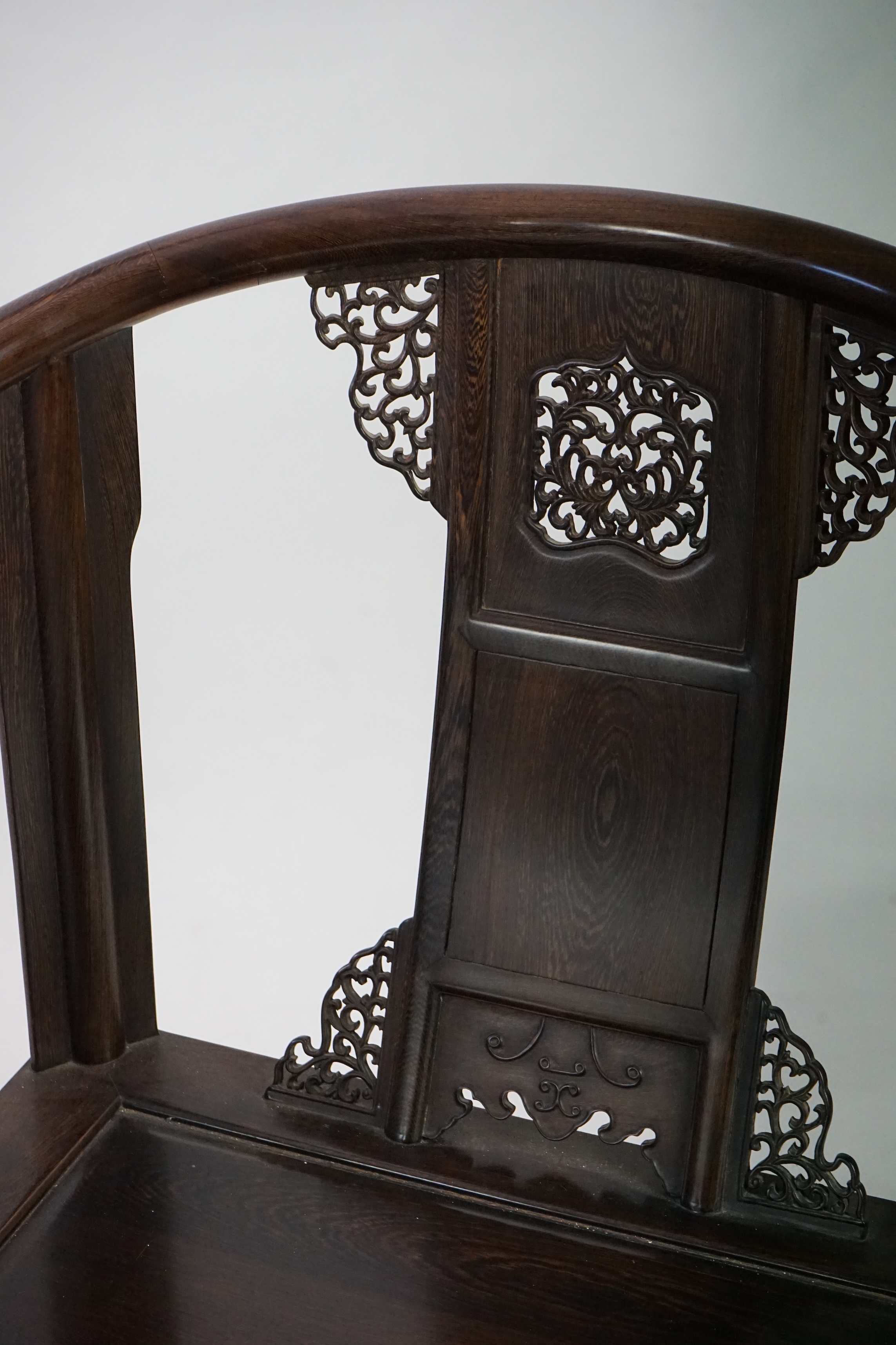 A pair of Chinese jichimu horseshoe shaped armchairs and a matching table, 19th/20th century